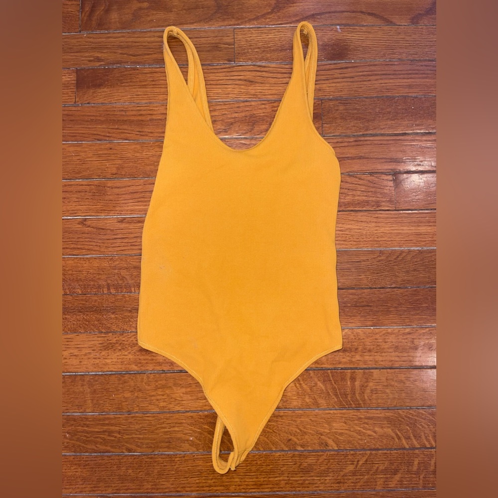 Mustard yellow bodysuit.